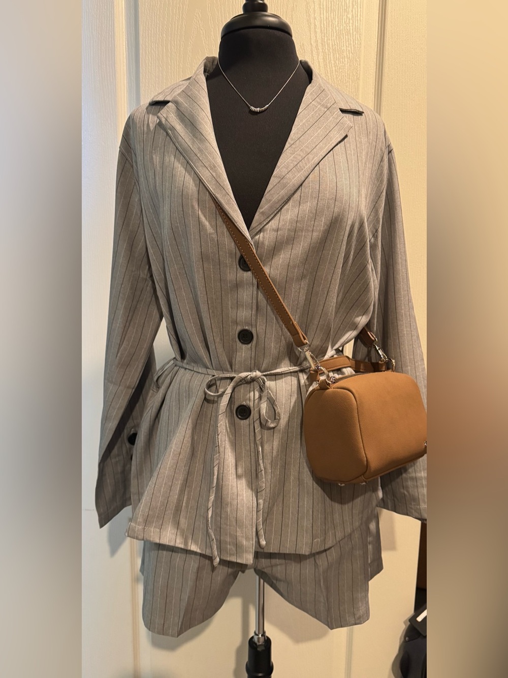 Gray Pinstripe Blazer and shorts with Camel HOLB Crossbody Bag and necklace.